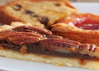 pecan pie slice in front of other pastries