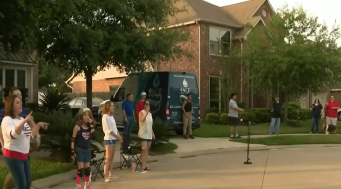 neighbors standing in driveway standing apart