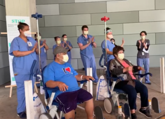 elderly couple leaving hospital in wheelchairs