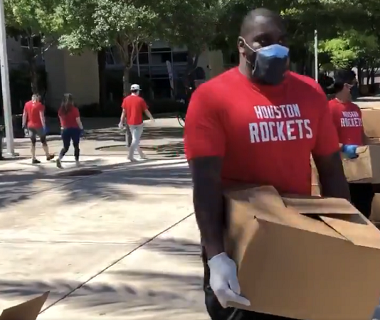 houston rockets employees handing out free groceries and meals