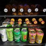 mini refrigerator with beer sodas and monster energy