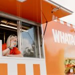 girl at whataburger food truck window