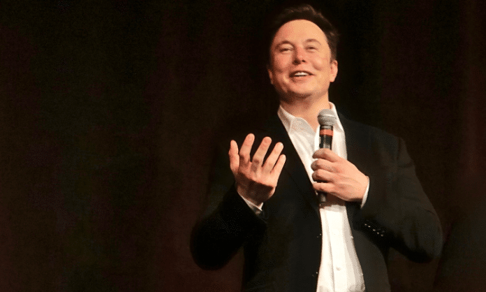 Elon Musk speaking on stage
