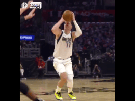 Dallas Mavericks Luka Doncic holding a basketball in the NBA playoffs Game 1