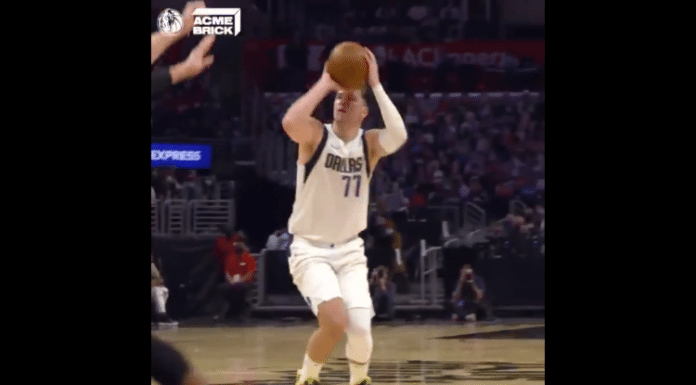 Dallas Mavericks Luka Doncic holding a basketball in the NBA playoffs Game 1