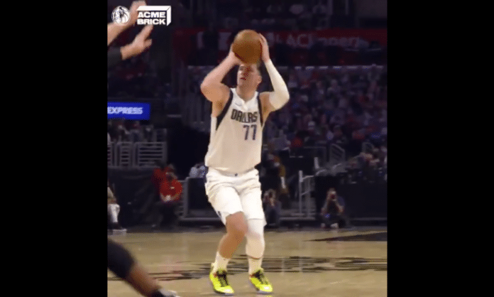 Dallas Mavericks Luka Doncic holding a basketball in the NBA playoffs Game 1