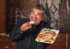 George Lopez eating one of his badass tacos