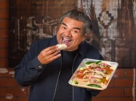 George Lopez eating one of his badass tacos