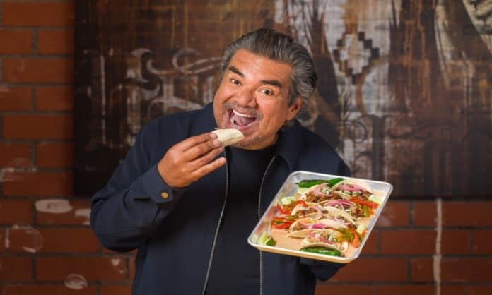 George Lopez eating one of his badass tacos