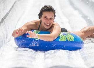 texas lady sliding down slip and slide at slide the slopes event in new braunfels texas 2021