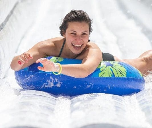 texas lady sliding down slip and slide at slide the slopes event in new braunfels texas 2021
