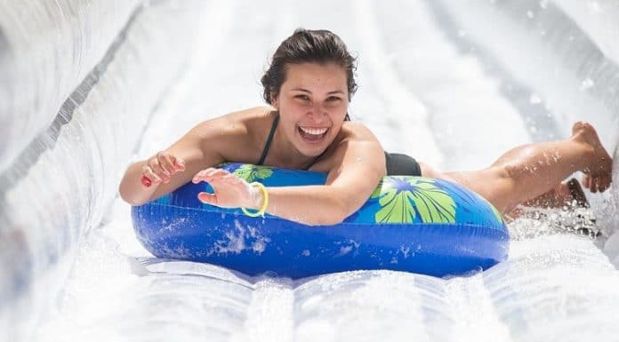 texas lady sliding down slip and slide at slide the slopes event in new braunfels texas 2021