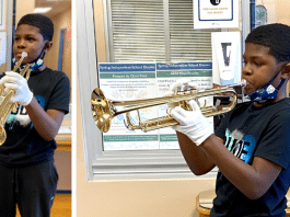 young Texas boy / student plays his band new trumpet at school in Houston