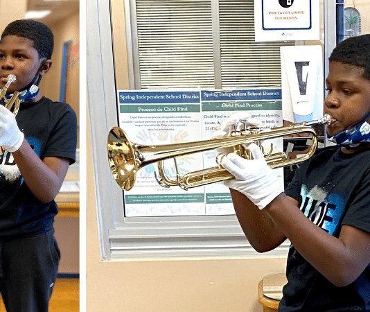 young Texas boy / student plays his band new trumpet at school in Houston