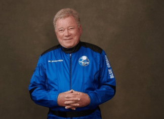 William Shatner dressed in a blue astronaut suit