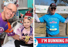 Larry DeSpain Texas runner smiling next to child cancer patient