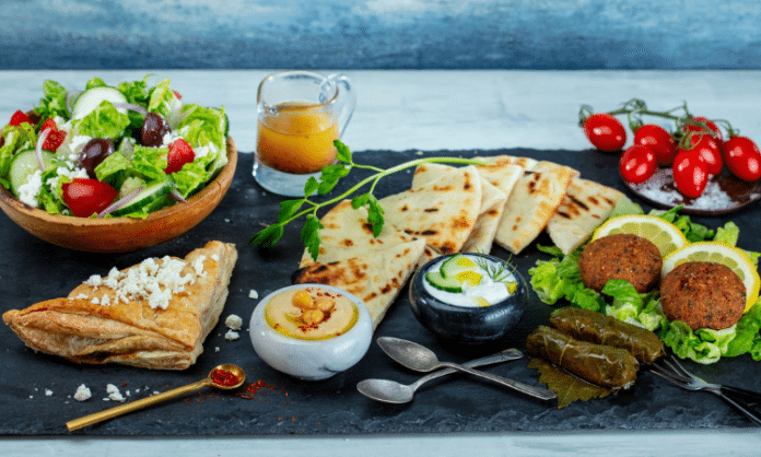 The Great Greek Mediterranean Grill food array on a table