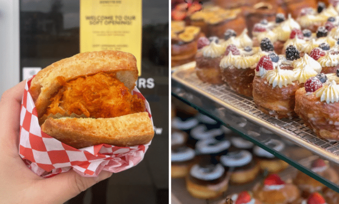 hand holding Nashville hot chicken sandwich in front of Honeybird and trays of gourmet donuts