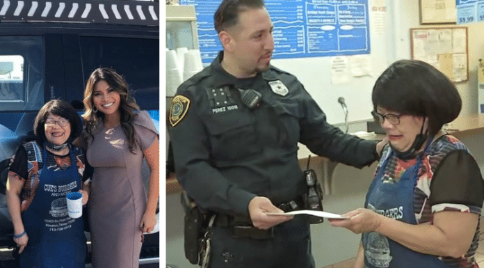 Mama Cue in houston being given a check by Houston police officer
