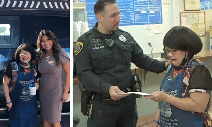 Mama Cue in houston being given a check by Houston police officer