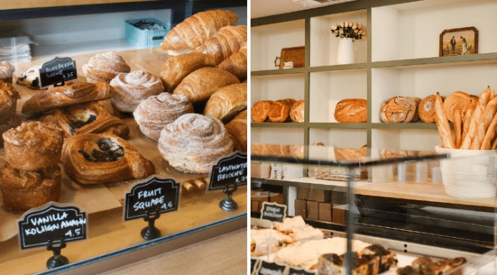 front shop of a cafe bakery with pastries for sale and a wall of baked bread from Village Baking Co in Dallas, TX