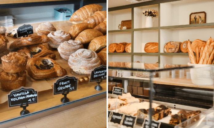 front shop of a cafe bakery with pastries for sale and a wall of baked bread from Village Baking Co in Dallas, TX