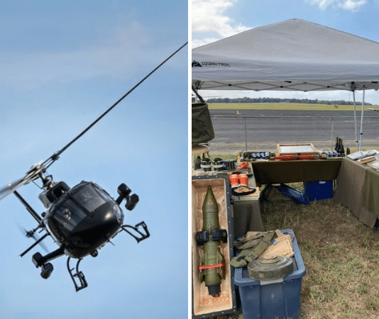 helicopter flying sideways and a booth of military antiques