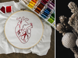 fiber art of a heart and white flowers