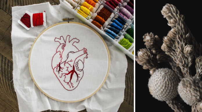 fiber art of a heart and white flowers