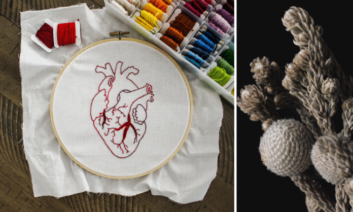 fiber art of a heart and white flowers