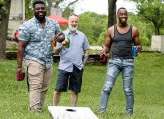 fathers playing cornhole